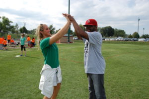 Two people giving each other a high five.