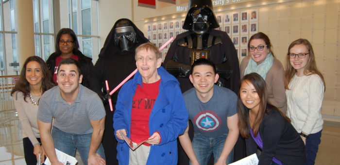 A group of people standing next to each other.