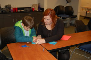Volunteer Helping Child