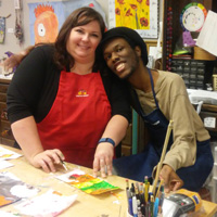 A woman and man are smiling at the camera.