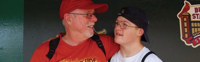 A man and boy are posing for the camera.