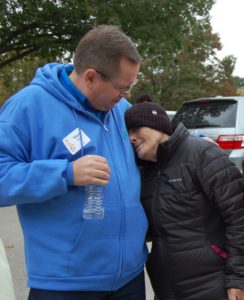 A man and woman standing next to each other.