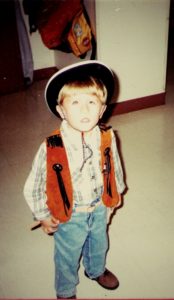 Young Alex dressed as a cowboy