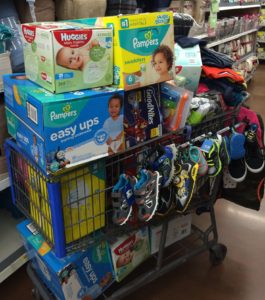 A cart full of baby items in the store.