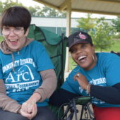 participant and staff at softball tournament