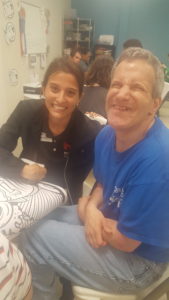 A man and woman smile for the camera.