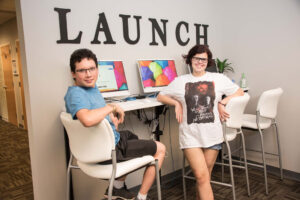 Young adults at the computers in the Next area