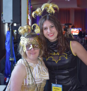 two young women at a party dressed as superheroes