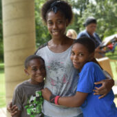 Mom with two sons posing for a photo