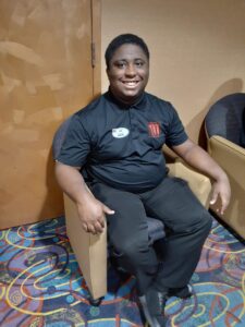 A person sitting on top of a chair.